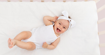 Newborn sleeping hotsell in crib